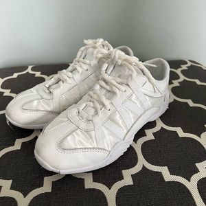 Used good condition adult size 6 nfinity cheer shoes with red case